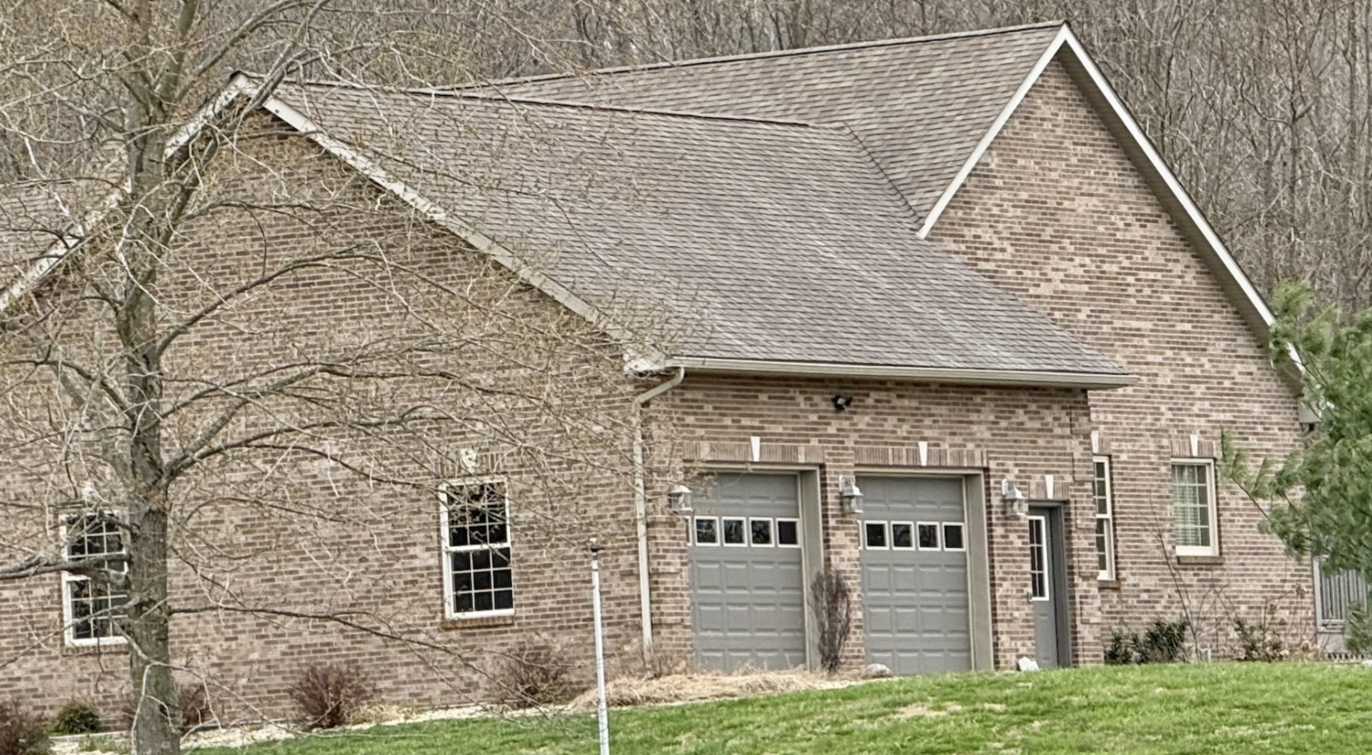 House Washing after: Brick house and roof wash