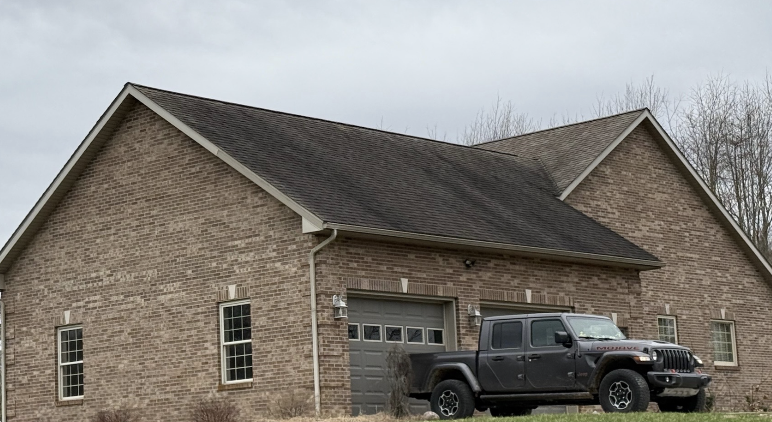 House Washing before: Brick house and roof wash
